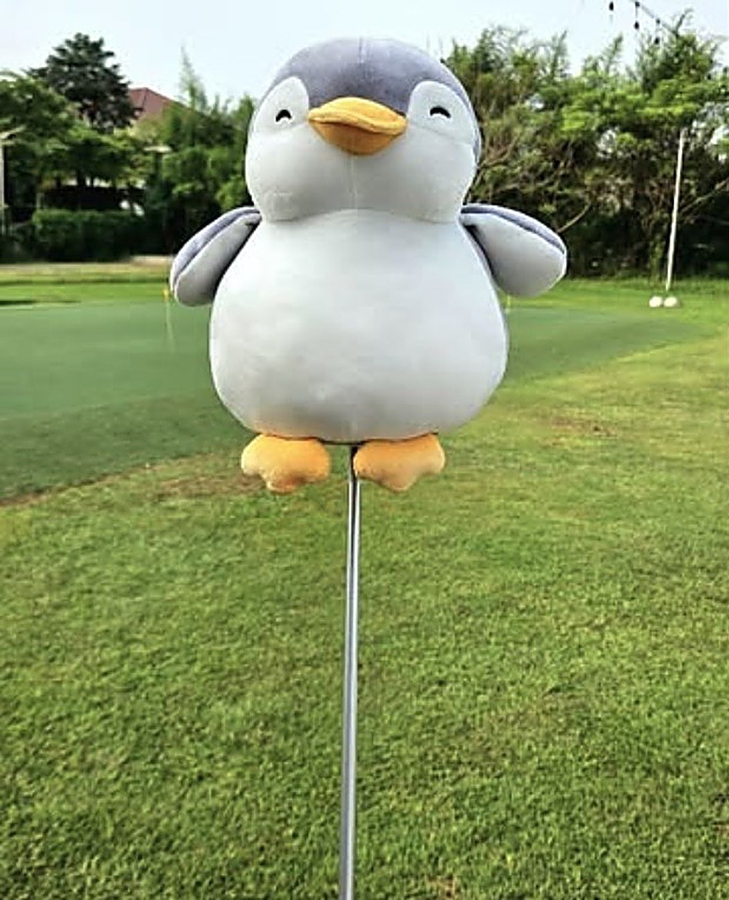 Pengu, a custom plush penguin golf headcover